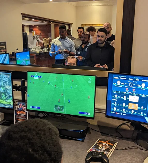 A mixed group of friends enjoying multiplayer console games