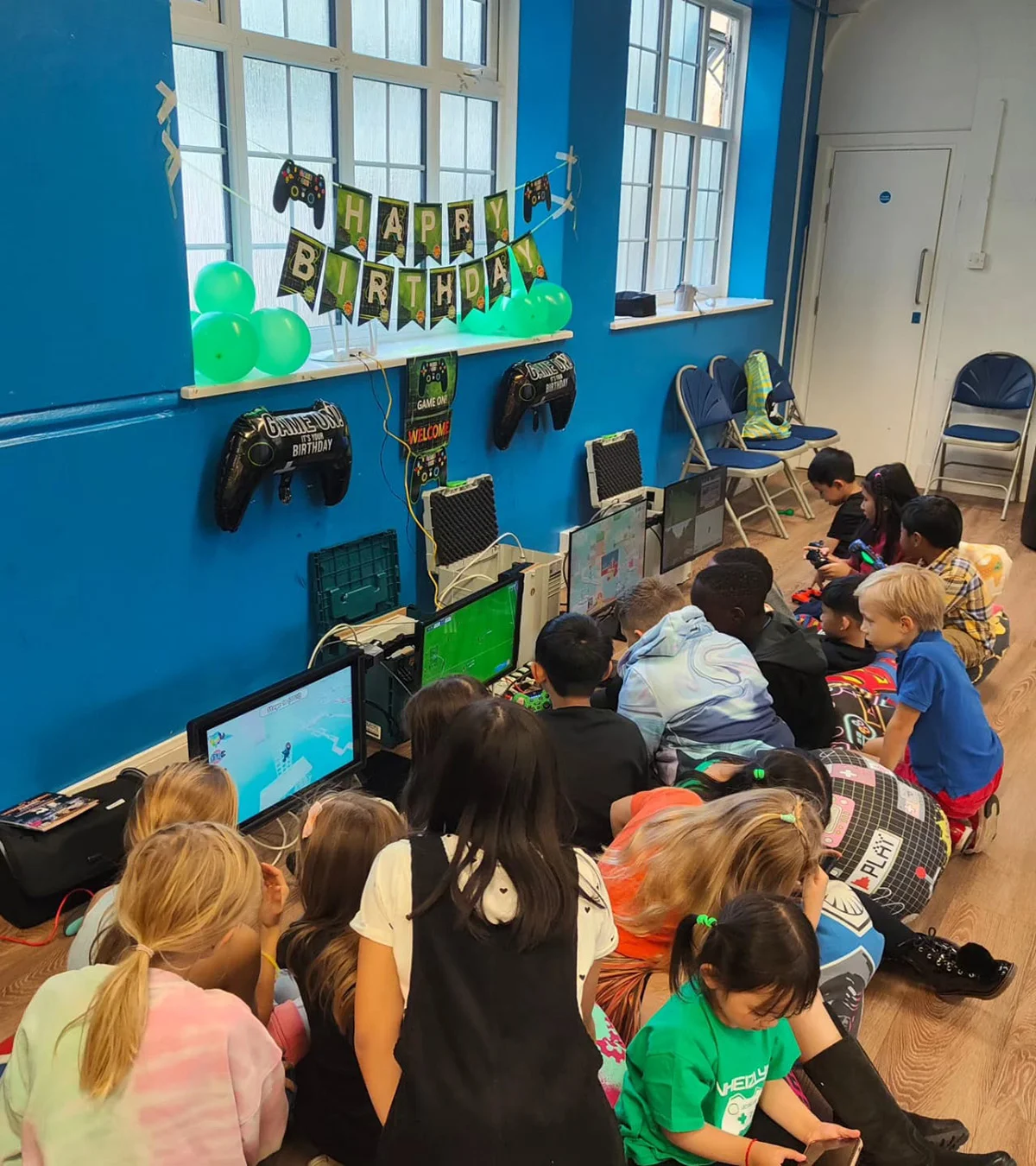Children enjoying a planned gaming party setup